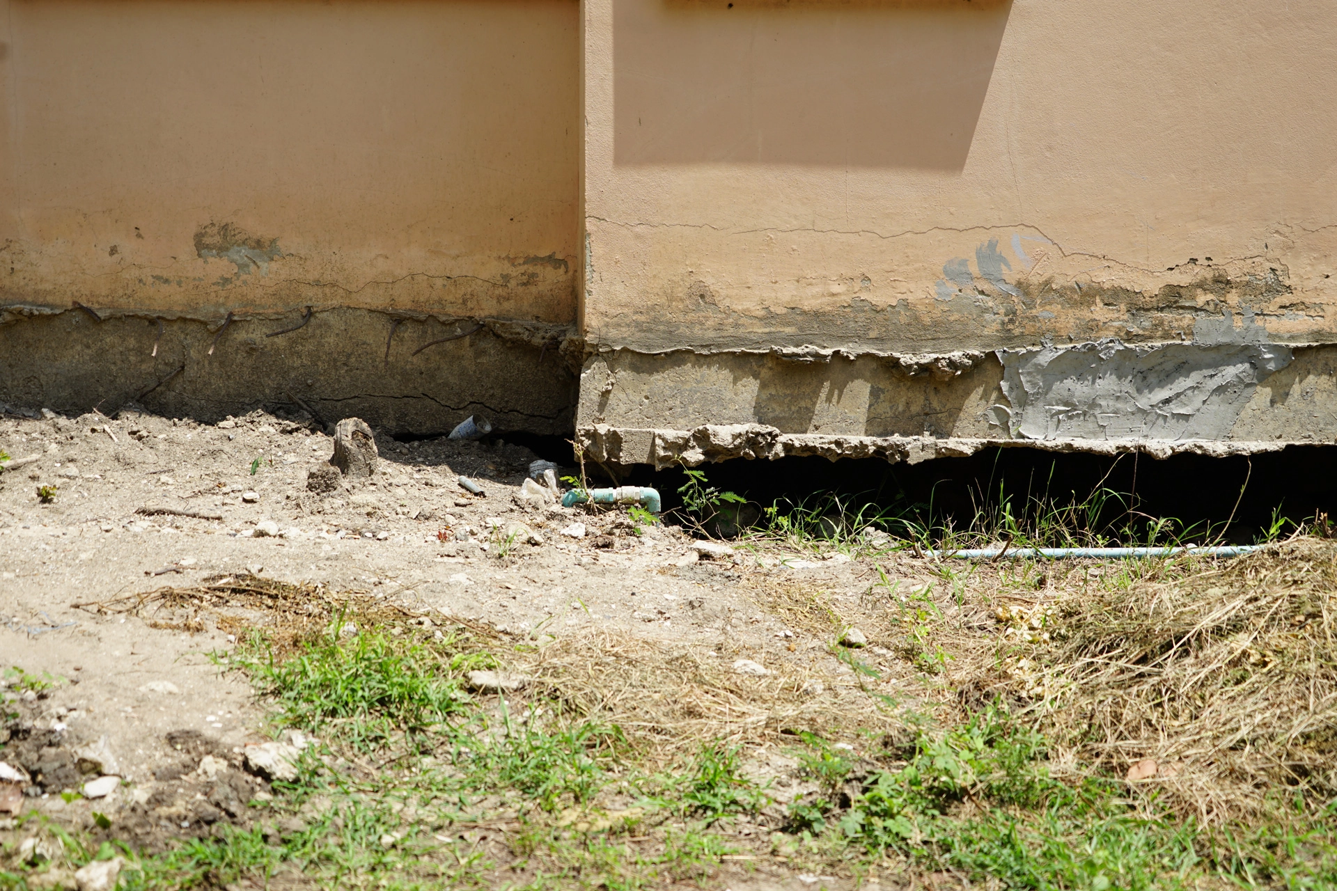 Foundation & Erosion damage caused by water overflowing from clogged gutters